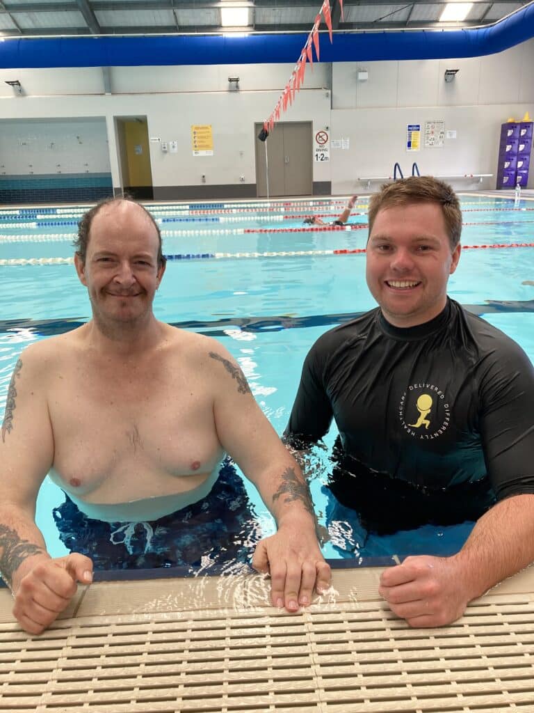 Mobile Physiotherapist with NDIS participant smiling in pool